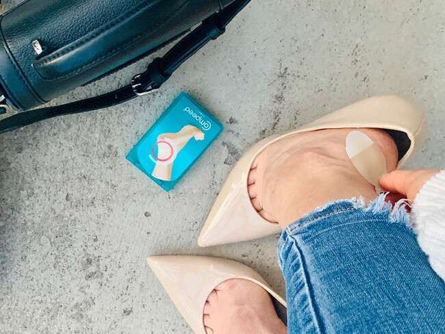 feet in high heels and blister plaster