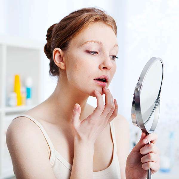 Woman touching her lip